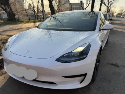 front of rent a Tesla Model 3 in Berlin