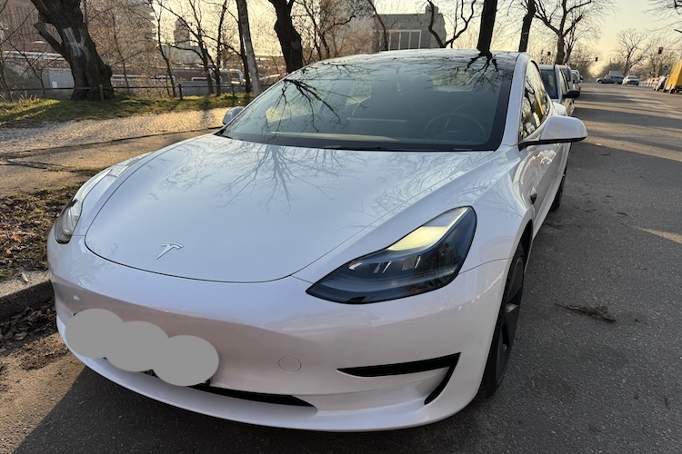 front of rent a Tesla Model 3 in Berlin