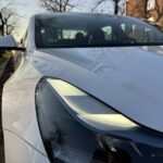 Frontlight of rent a Tesla Model 3 in Berlin