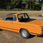 Back View of BMW 2002 Baur Cabrio classic car rental in Munich