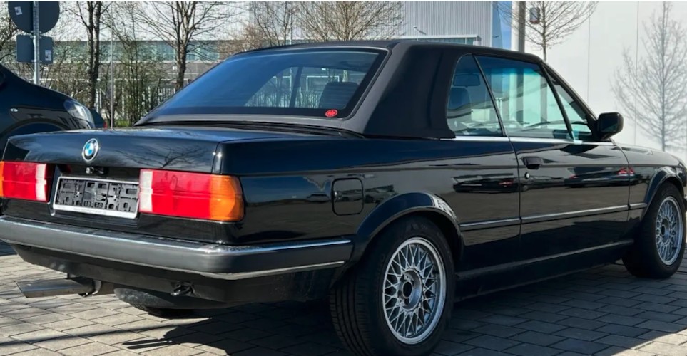 Back View of a BMW 320i Cabrio classic car rental in Munich