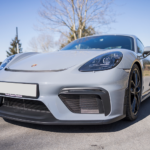Front view Porsche Cayman GT4 on Lake Constance