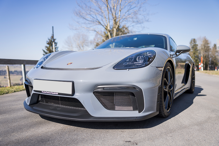 Front view Porsche Cayman GT4 on Lake Constance