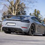 Rear view Porsche Cayman GT4 on Lake Constance