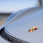 Front logo Porsche Cayman GT4 on Lake Constance