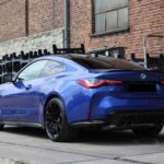 site view back driver form BMW M4 Competition in Dortmund