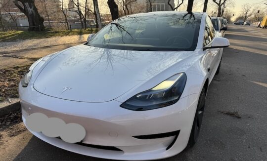 front of rent a Tesla Model 3 in Berlin