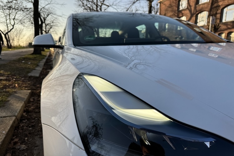 Frontlight of rent a Tesla Model 3 in Berlin