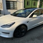 Side of rent a Tesla Model 3 in Berlin