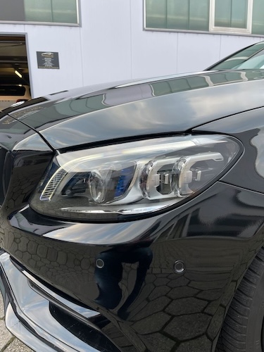 Front lights of Rent a Mercedes C63S AMG in Dortmund