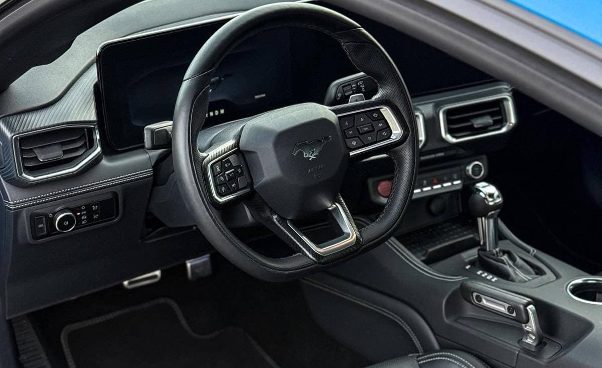 Rent Ford Mustang GT in Potsdam cockpit